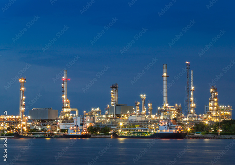 Oil refinery plant industry at dramatic twilight