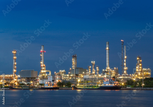 Oil refinery plant industry at dramatic twilight