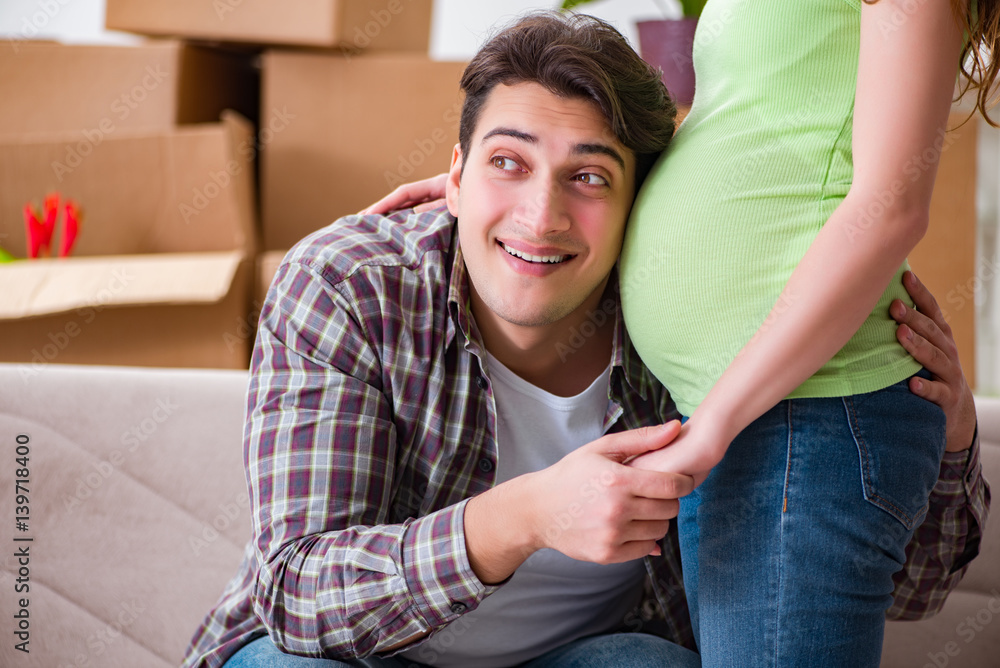 Fototapeta premium Young couple of man and pregnant wife expecting baby