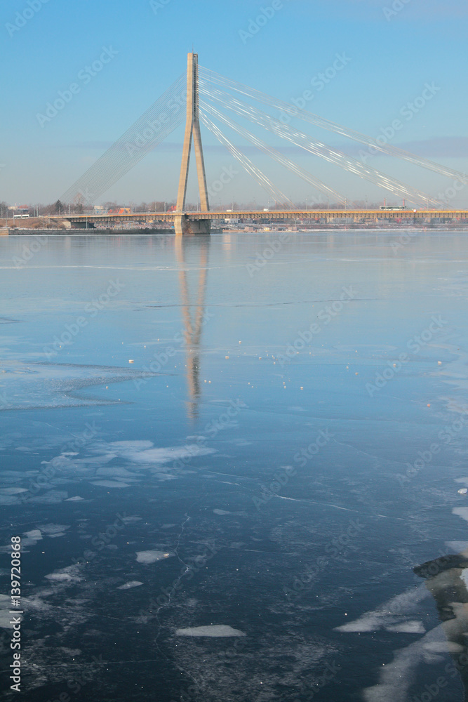 Fototapeta premium River and cable-stayed bridge. Riga, Latvia