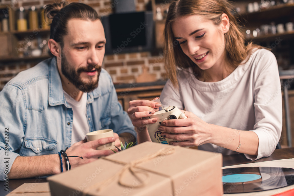 Young couple with instant camera Young couple with instant camera