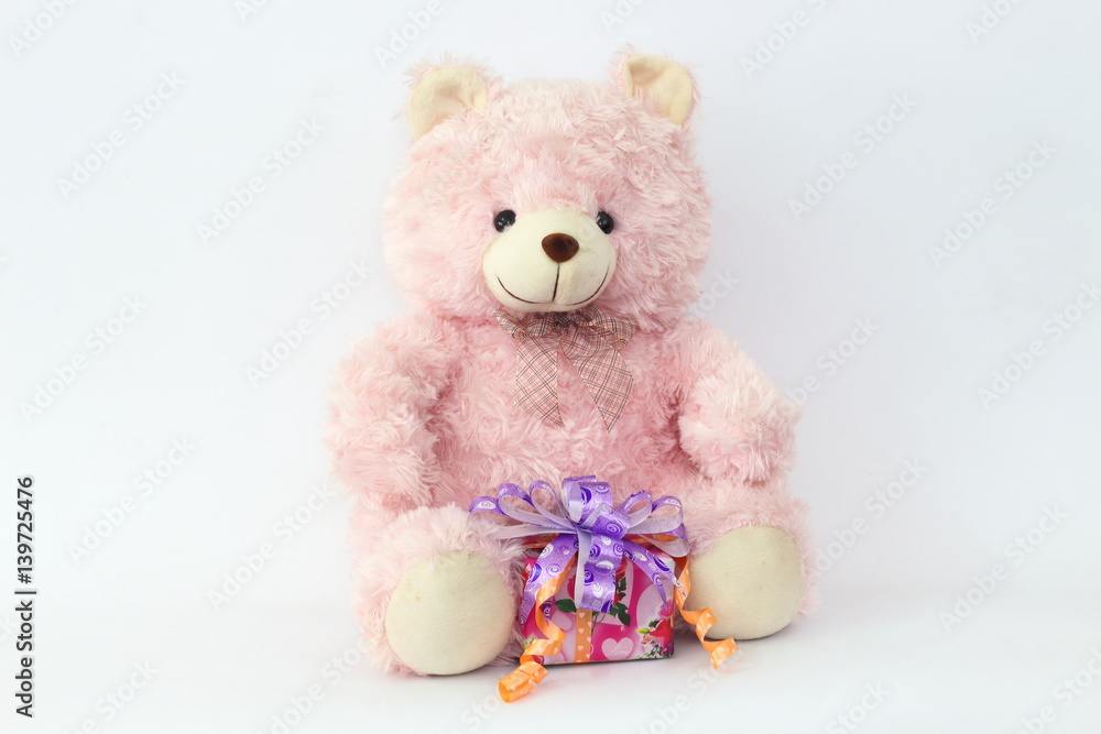 Pink teddy bear and gift boxes on a white background. Pink teddy bear and gift boxes on a white background.