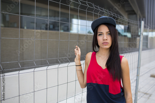 Portrait of a beautiful young woman in urban background