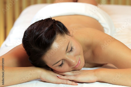 Young woman relaxing with a massage