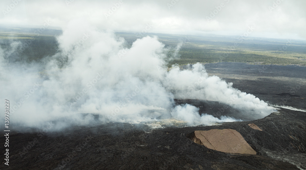 Smoking Pu'u O'o crater Hawaii, aerial view