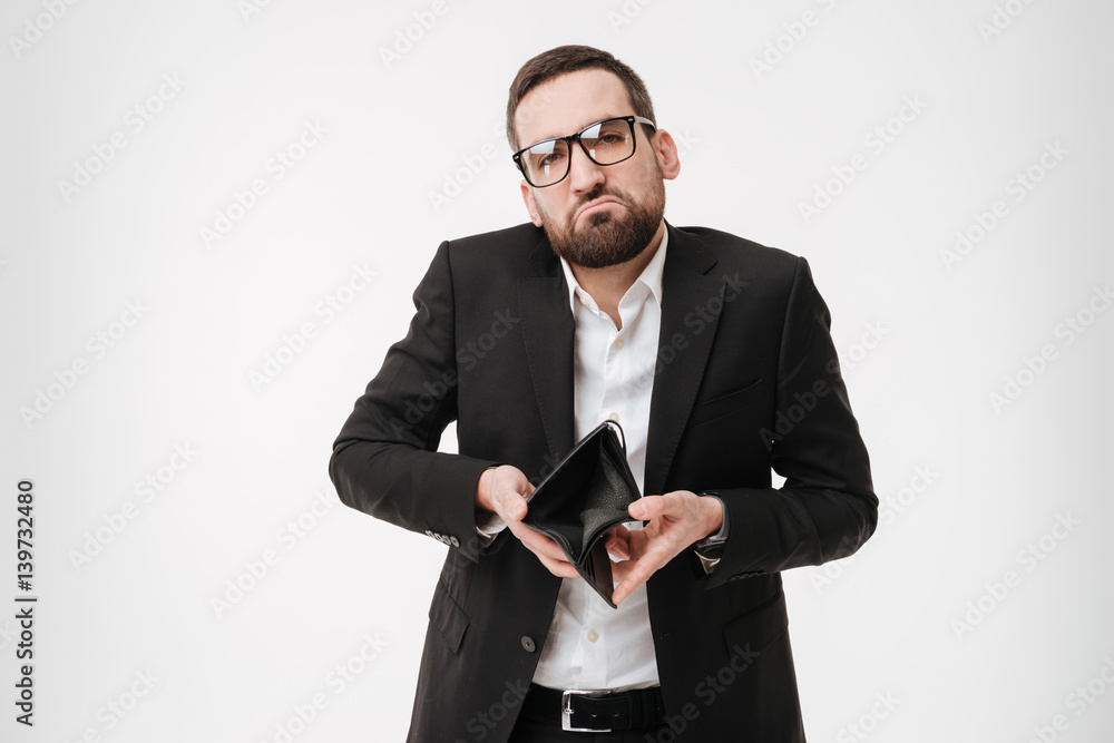 Sad businessman holding purse without money. Sad businessman holding purse without money.