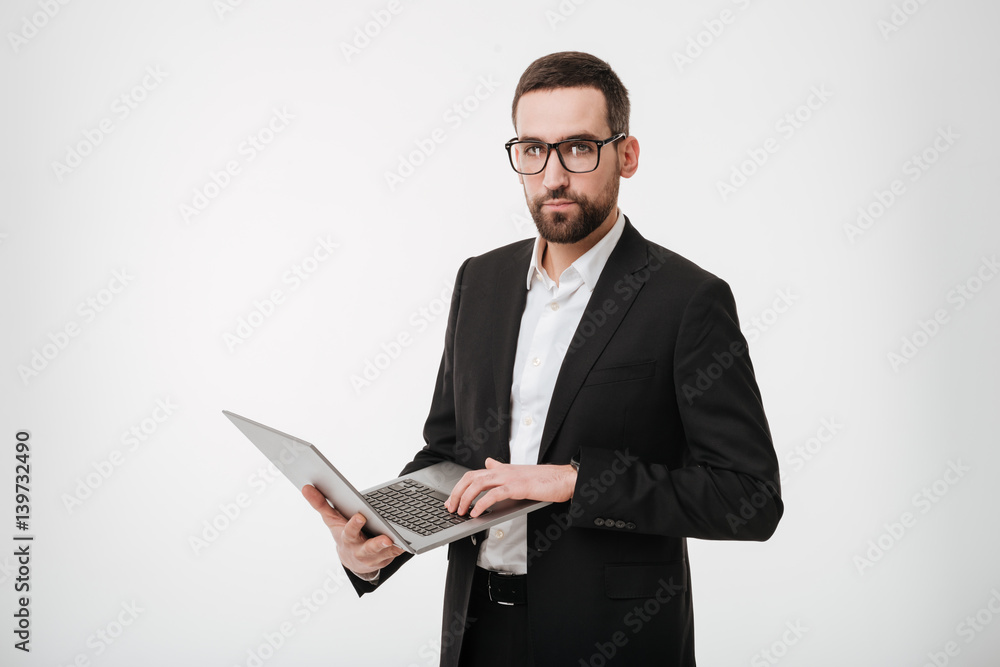 Handsome businessman using laptop computer. Handsome businessman using laptop computer.