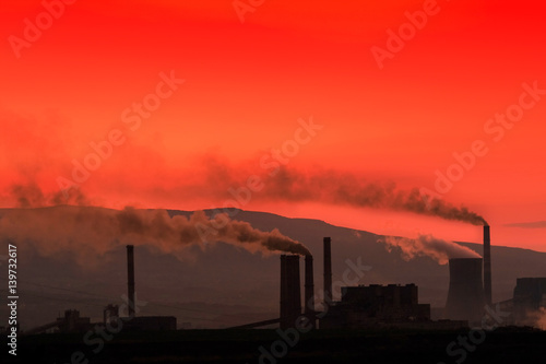 factory chimneys on a background of mountains