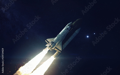 Naklejka Space shuttle orbiting Earth planet. Elements of this image furnished by NASA