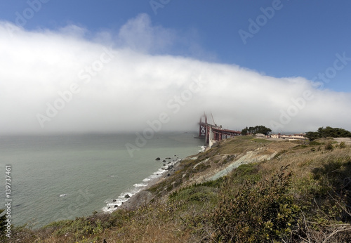 Fog bank engulfing San Francisco's Golden gate Bridge.