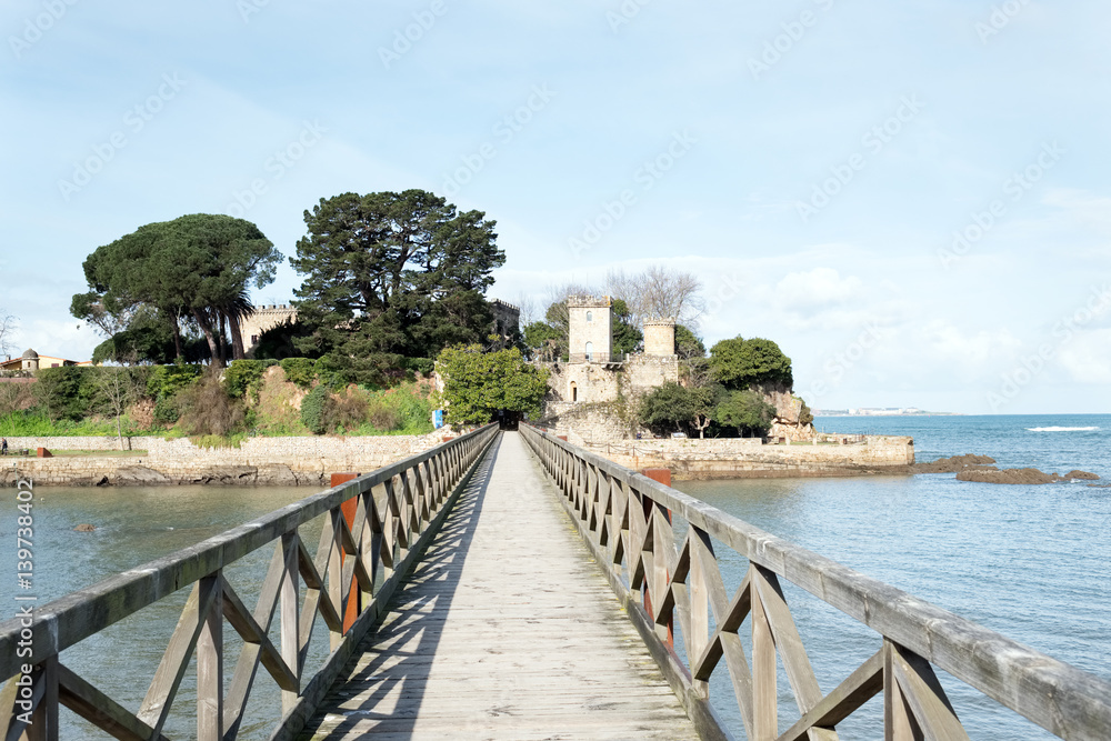 Different views of a medieval castle, near the beach and connected by a bridge. in La coruna, Galicia, Spain