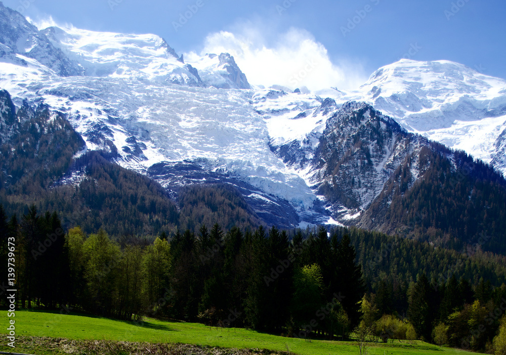 Mont Blanc Mountain covered with snow in spring. Amazing panorama with snow avalanche of French Alps in the spring.