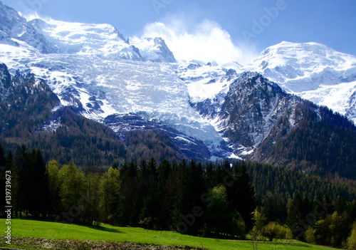 Mont Blanc Mountain covered with snow in spring. Amazing panorama with snow avalanche of French Alps in the spring.