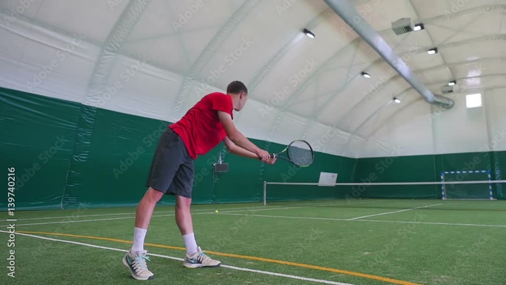 A guy throwing a tennis ball on the grass A guy throwing a tennis ball on the grass
