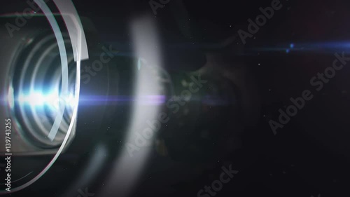 TV intro. Movement of the camera lens with lights.