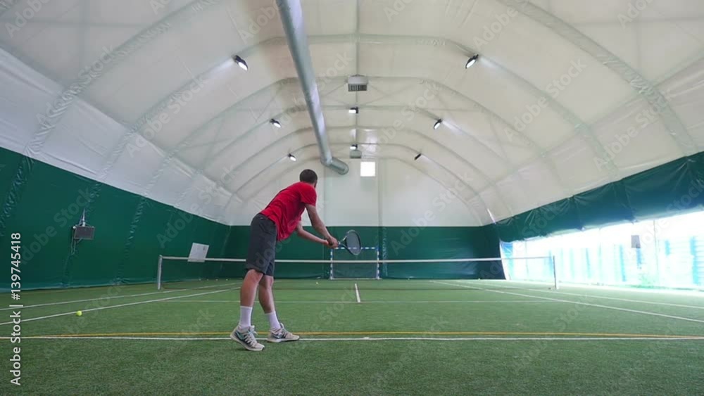 The athlete training on tennis court The athlete training on tennis court