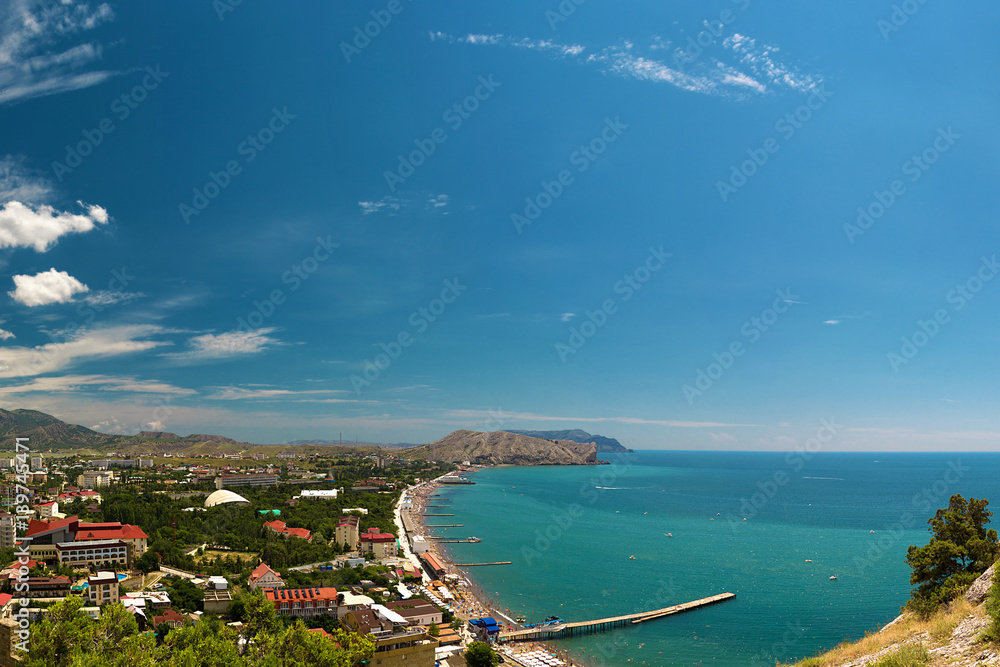 Panorama of the resort town of Sudak in the Crimea. Beautiful summer marine landscape. Travel photos
