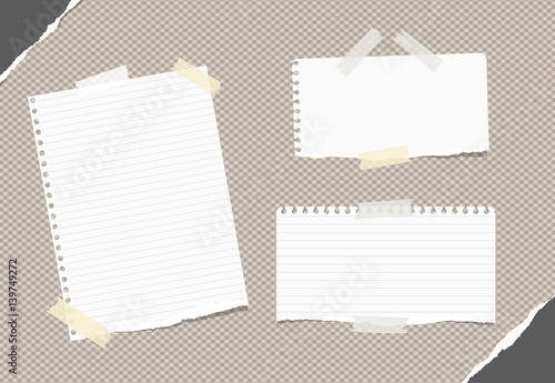 Ripped white ruled, blank note, notebook, copybook sheets stuck with white sticky tape on brown squared pattern, torn paper in corners