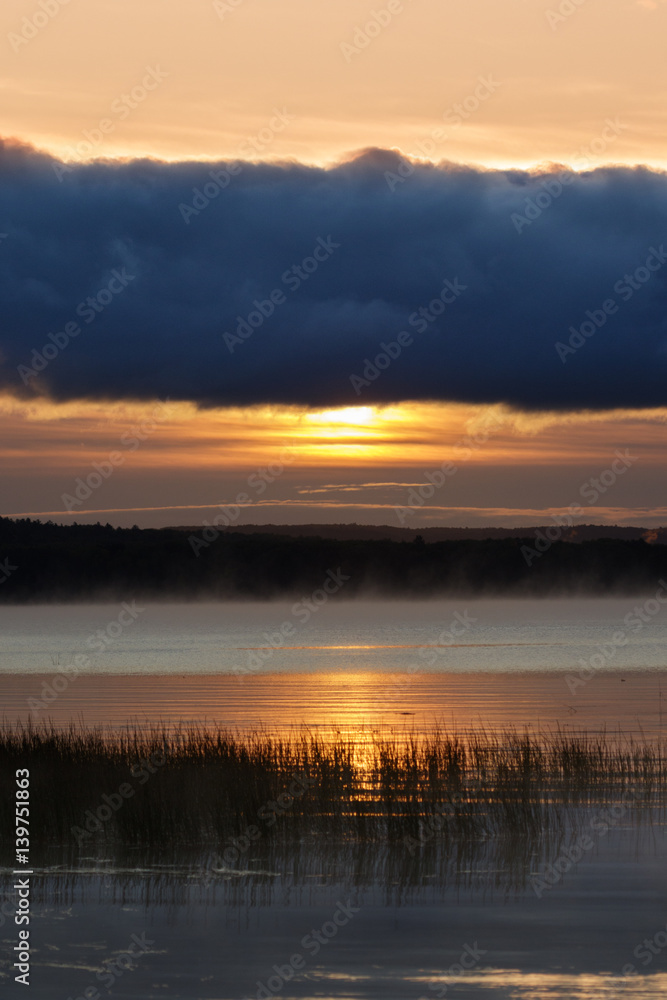 Sunrise over round lake