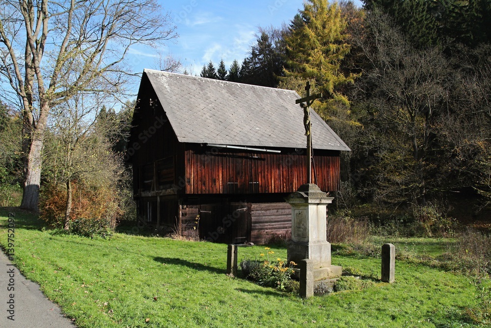 Old barn and cross in Bohemian Switzerland Old barn and cross in Bohemian Switzerland