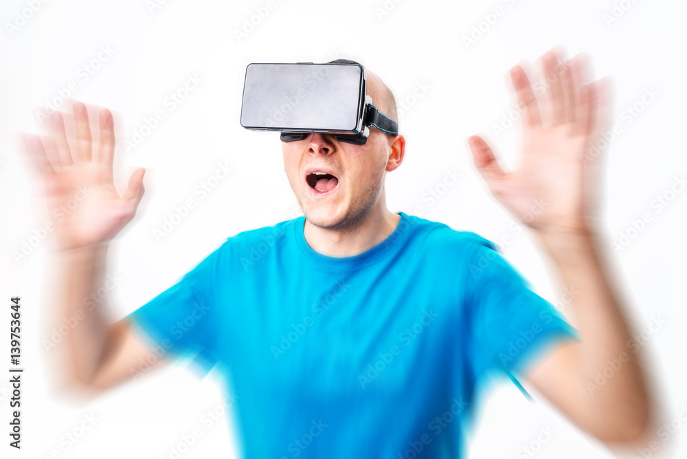 man using a VR headset and experiencing virtual reality isolated on white background man using a VR headset and experiencing virtual reality isolated on white background