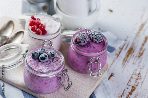 Obraz na plátne Selection of colourful overnight oatmeals with berries