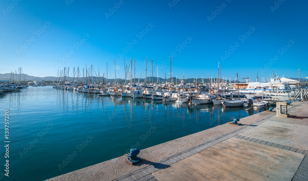 Sailboats & pleasure craft moored.  Morning in the harbor of Sant Antoni de Portmany, Ibiza town, Balearic Islands, Spain.