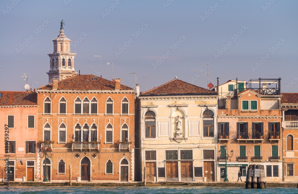 VENICE, ITALY - FEBRUARY 8, 2015: City architecture on a sunny day. Venice is a famous destination in Italy