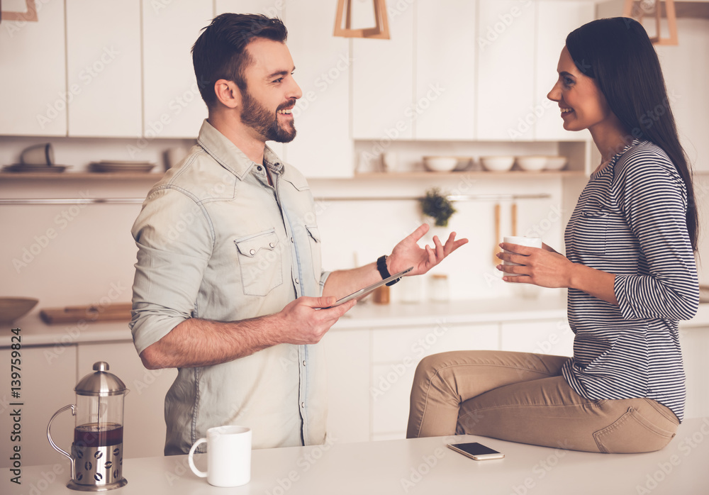 Fototapeta premium Beautiful couple in kitchen