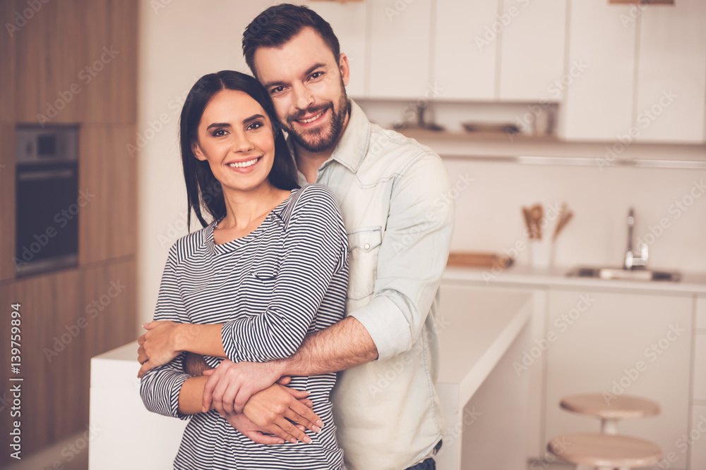Beautiful couple in kitchen Beautiful couple in kitchen