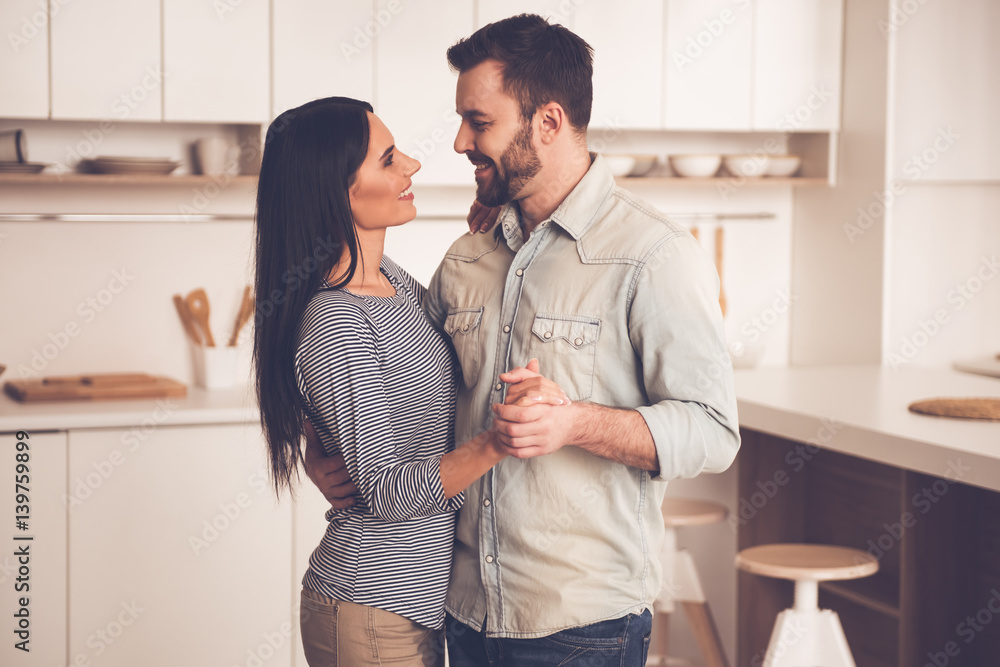 Beautiful couple in kitchen Beautiful couple in kitchen