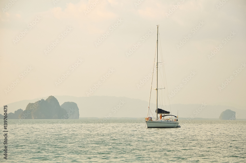 Sailing yacht in the sea among the islands