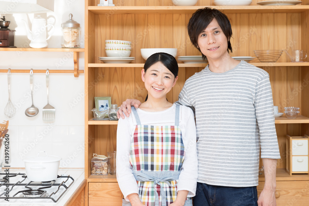 portrait of young asian couple in the kitchen portrait of young asian couple in the kitchen