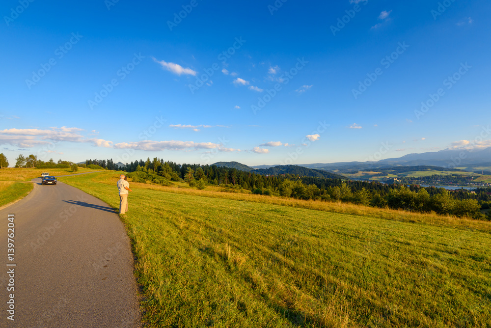 Fototapeta premium A road in mountain at warm summer light. Pieniny , Poland.
