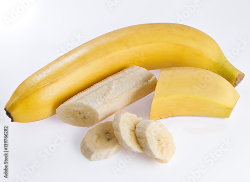 Bananas with slices on a white background.