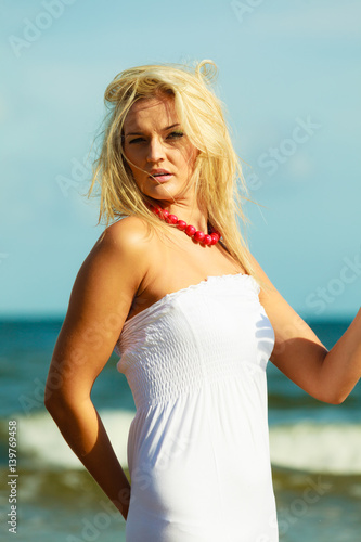 Nice female enjoying nature and beach. © Voyagerix