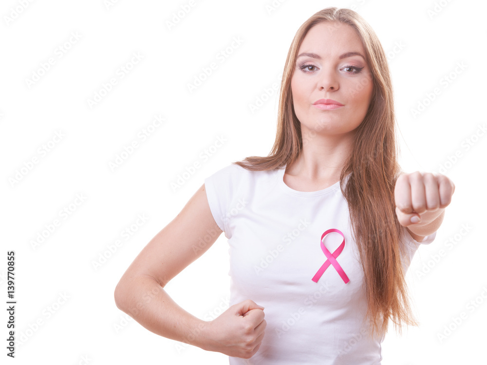 Woman wih pink ribbon on chest punching boxing Woman wih pink ribbon on chest punching boxing