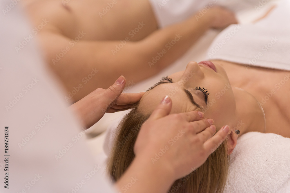 woman receiving a head massage