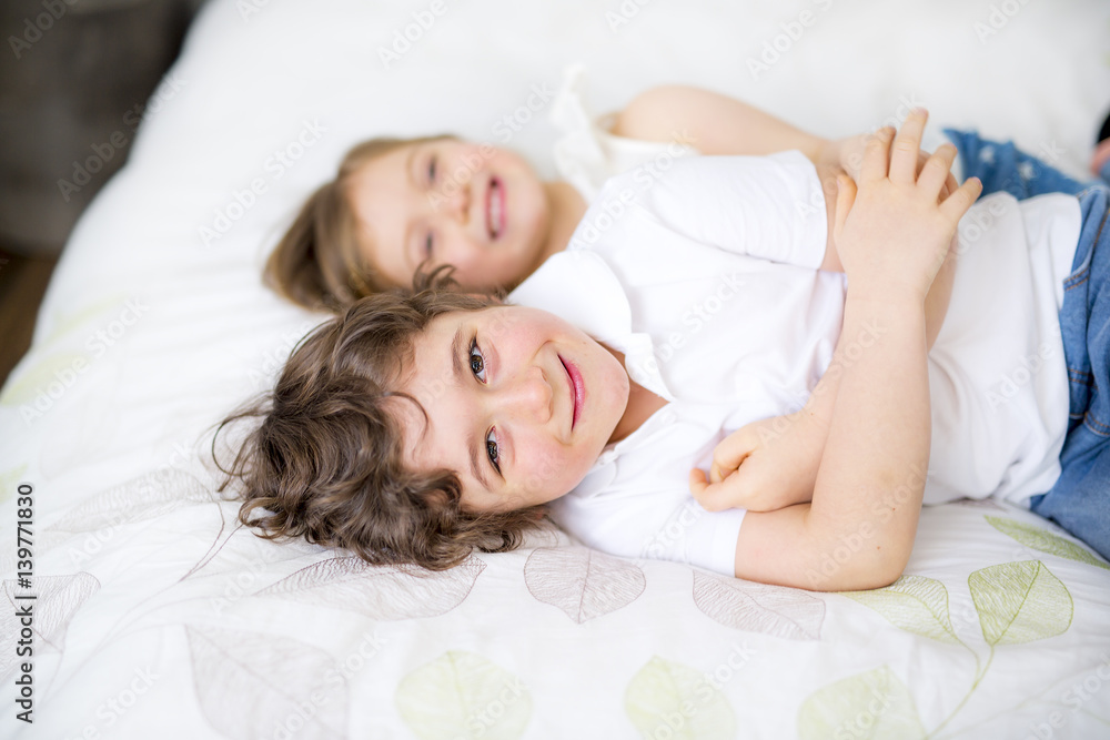 Brother And Sister Relaxing Together In Bed Brother And Sister Relaxing Together In Bed