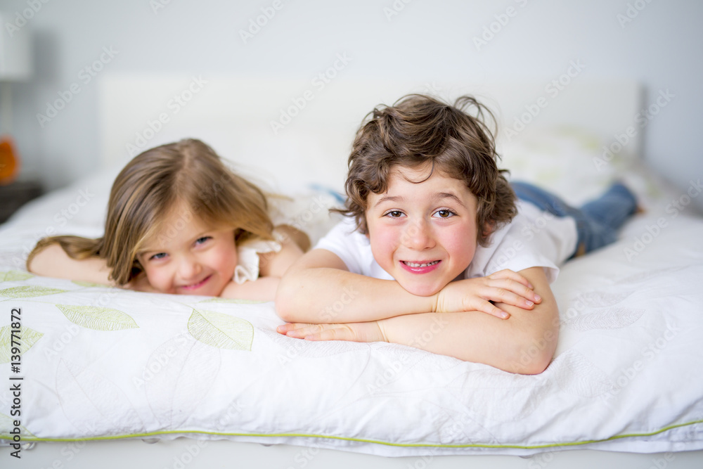 Brother And Sister Relaxing Together In Bed Brother And Sister Relaxing Together In Bed