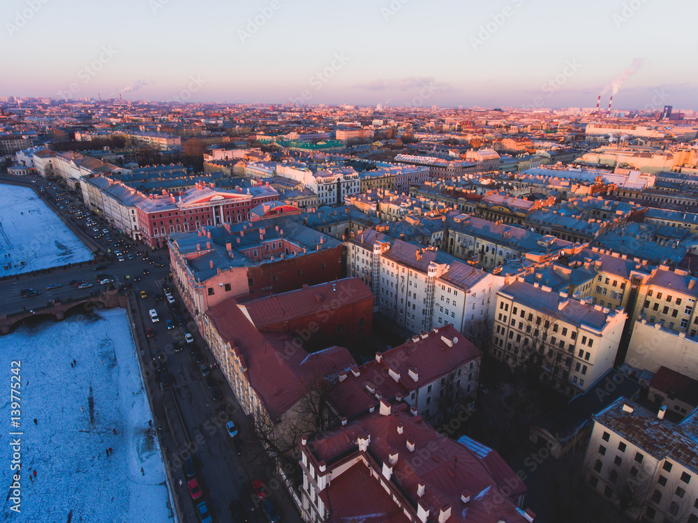 Beautiful super wide-angle summer aerial view of Saint-Petersburg, Russia with skyline and scenery beyond the city and Nevsky Prospect, seen from the quadrocopter air drone