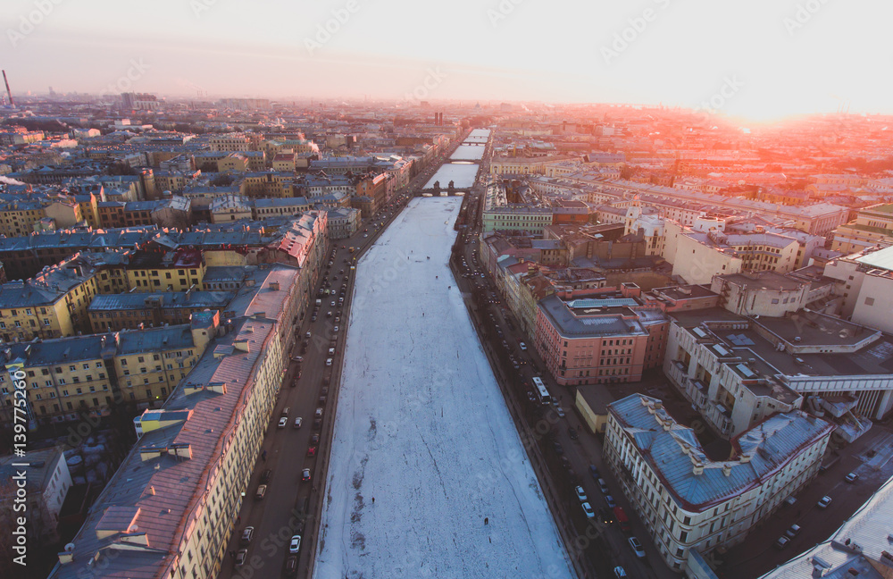 Beautiful super wide-angle summer aerial view of Saint-Petersburg, Russia with skyline and scenery beyond the city and Nevsky Prospect, seen from the quadrocopter air drone
