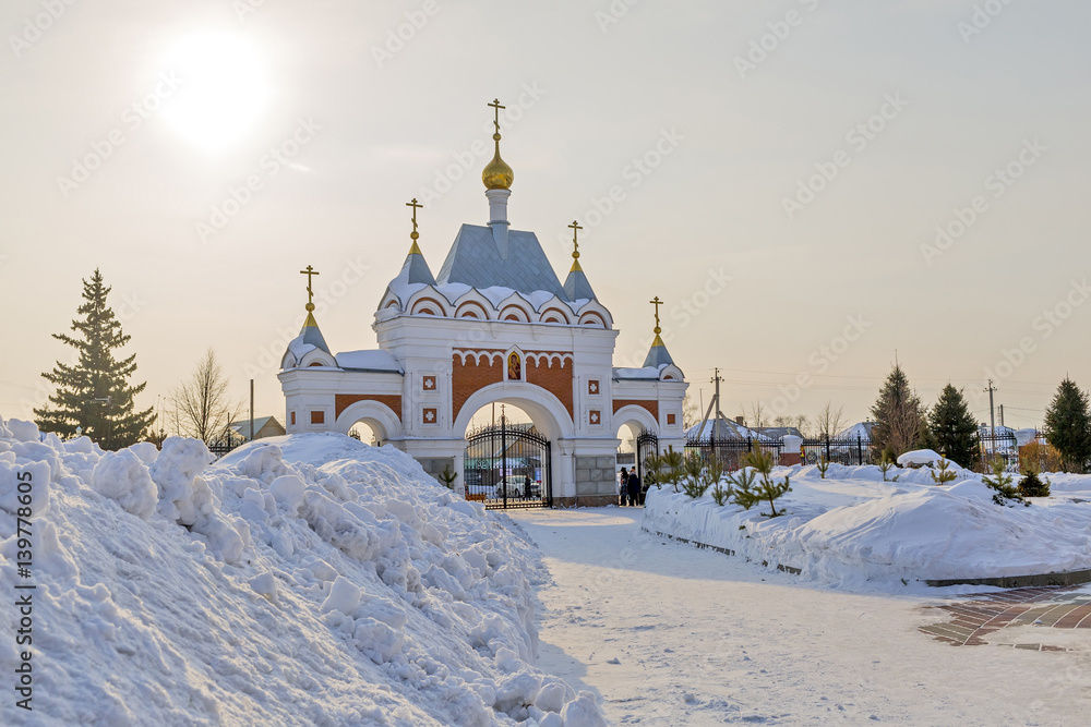 The main entrance to the territory of the Orthodox temple in honor of the Transfiguration. The town of Berdsk in Novosibirsk oblast, Siberia, Russia The main entrance to the territory of the Orthodox temple in honor of the Transfiguration. The town of Berdsk in Novosibirsk oblast, Siberia, Russia
