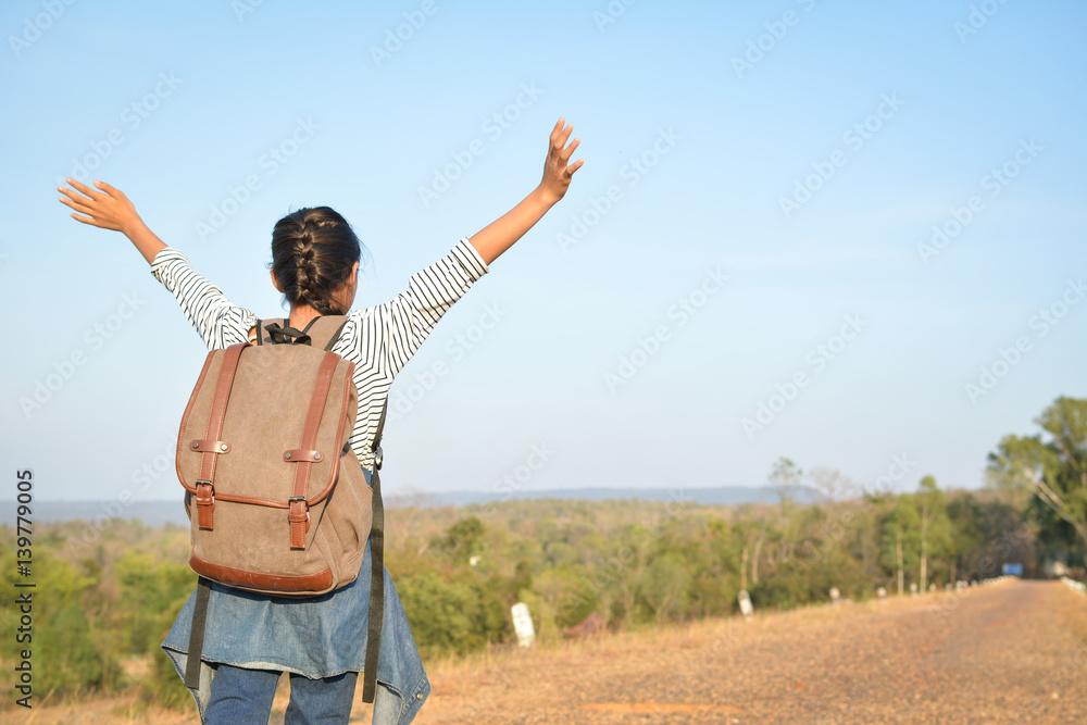Happy Asian girl backpack in nature background, Relax time on holiday concept travel ,color of vintage tone and soft focus Happy Asian girl backpack in nature background, Relax time on holiday concept travel ,color of vintage tone and soft focus