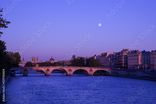 Moonrise over Seine River in Paris, France