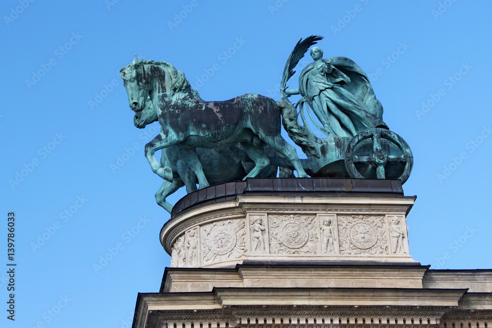 Obraz premium Millennium Monument on the Heroes' Square in Budapest, Hungary. Bronze sculpture of Chariot of the War.