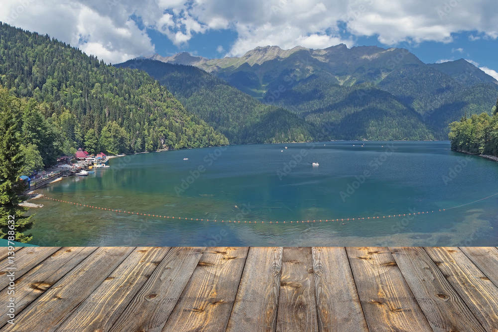 Empty wooden flooring against the lake in mountains