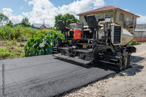 Bild auf Leinwand Asphalt road paver paiving machine construction industry roadwork repair