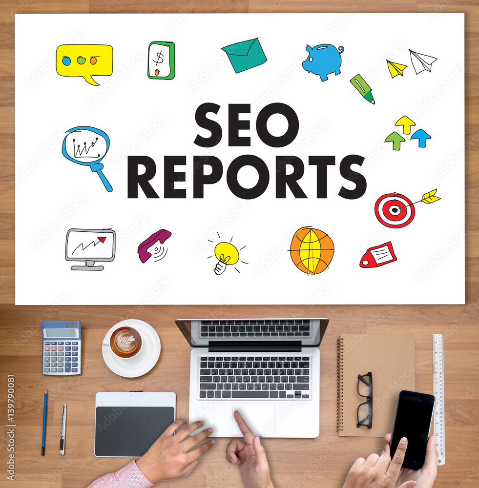 SEO REPORTS Concept Business team hands at work with financial reports and a laptop SEO REPORTS Concept Business team hands at work with financial reports and a laptop