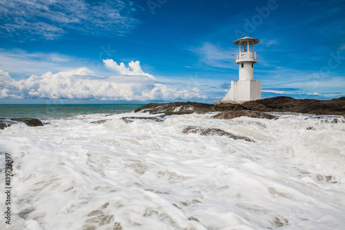 Waves crashing into lighthouse